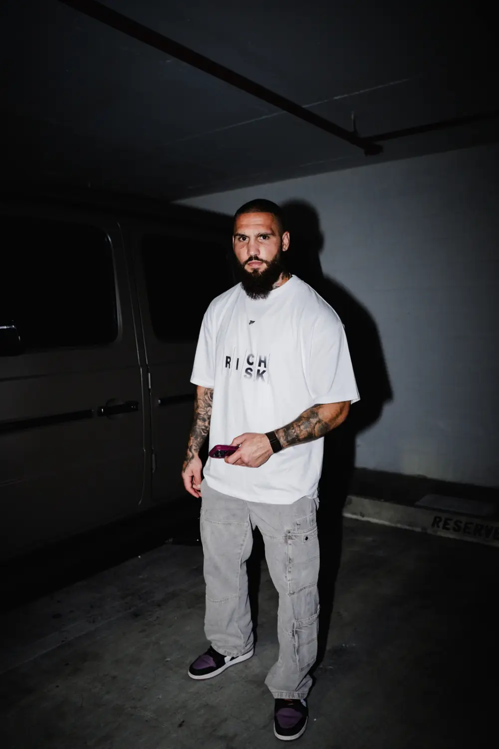 Group wearing Trader Fits tees and hoodies on location