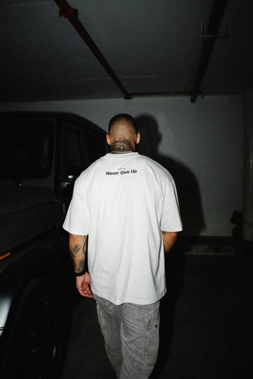 Group wearing Trader Fits tees and hoodies on location