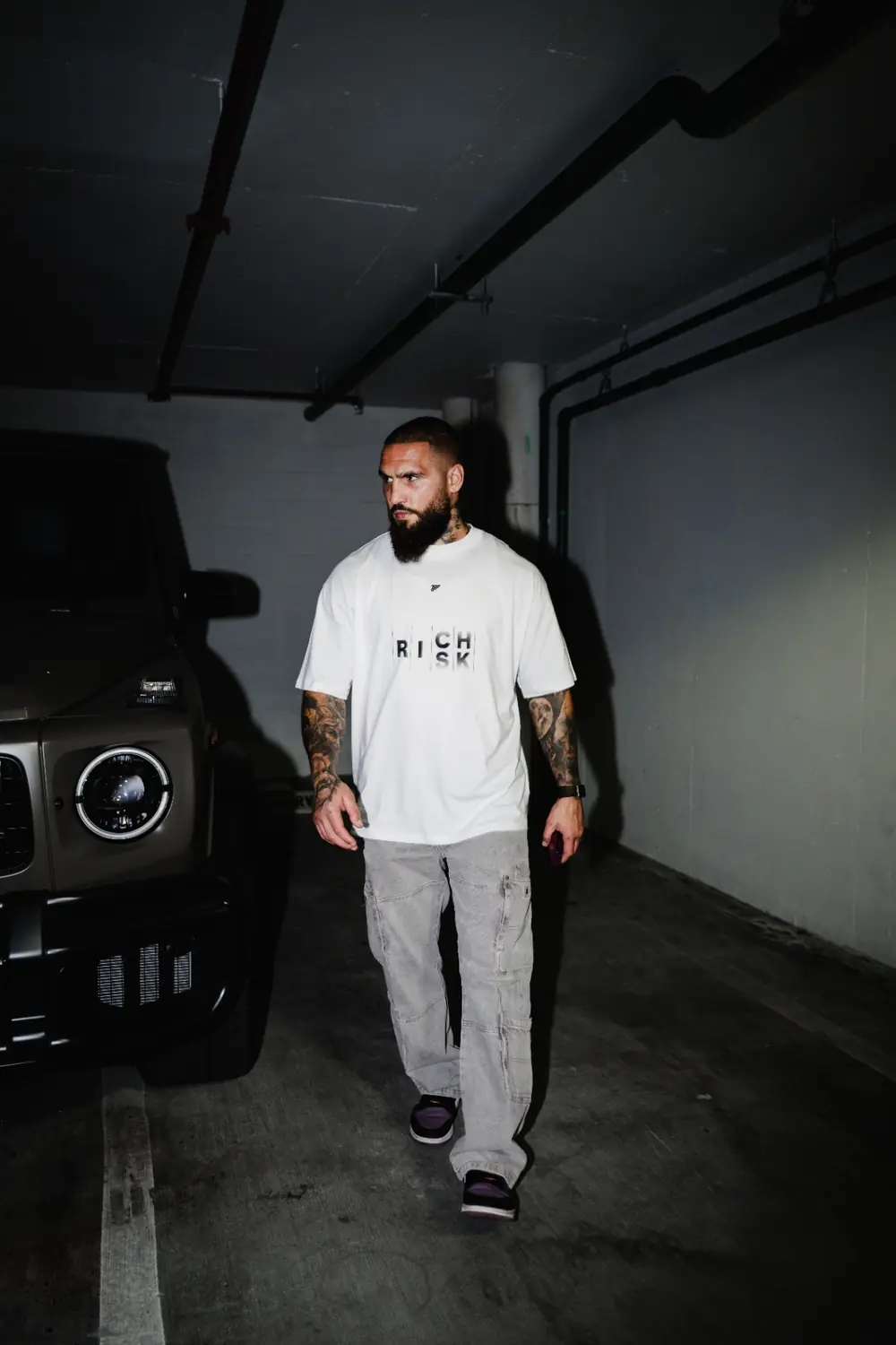 Group wearing Trader Fits tees and hoodies on location
